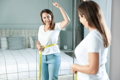 Woman looking in mirror