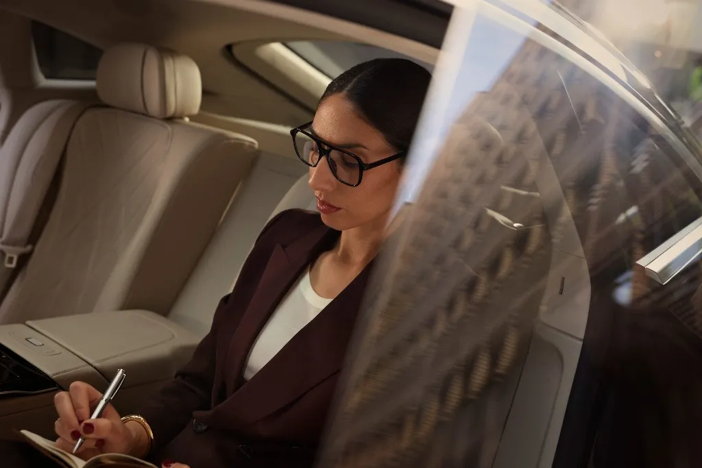 Chauffeur in luxury car
