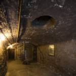 Basement of the East Wing with view to holding cell and Parnell graffiti on wall. Peter Moloney Photography.