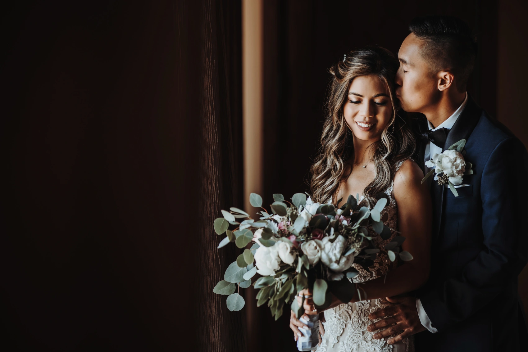Traditional South Asian bridal portrait with intricate henna